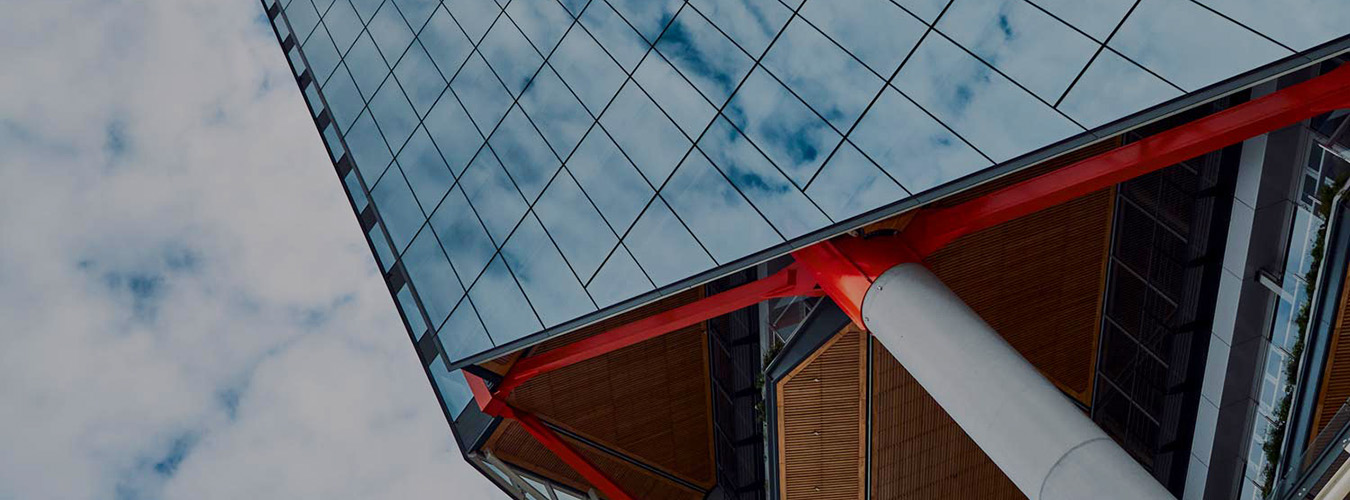 Clouds reflected in the glass facade of a skyscraper