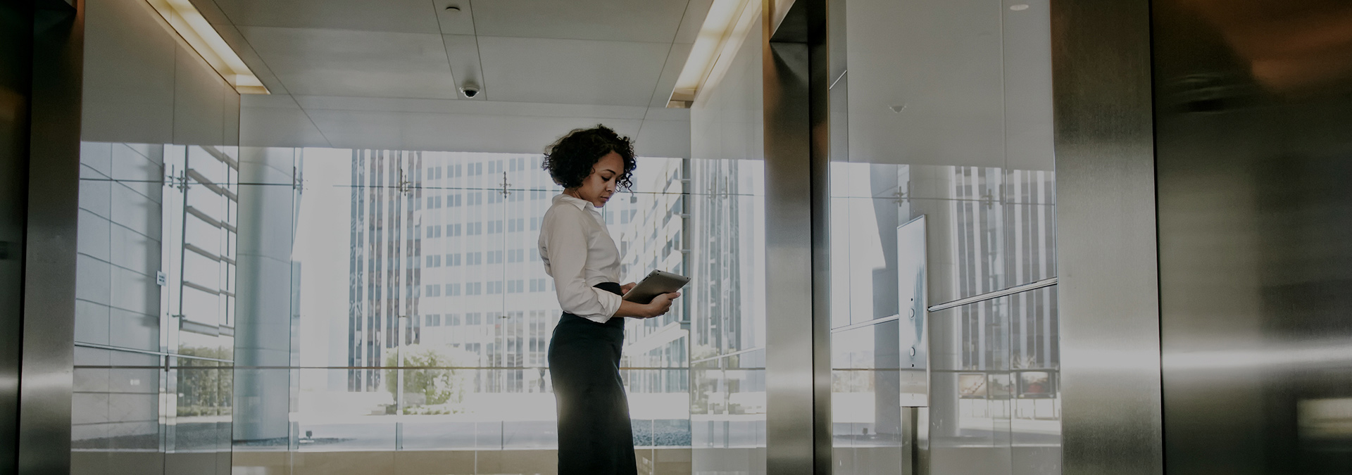 lady waiting for otis elevator